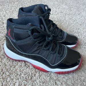 Nike Air Jordan Retro 11 Bred Black and Red High Top Sneakers